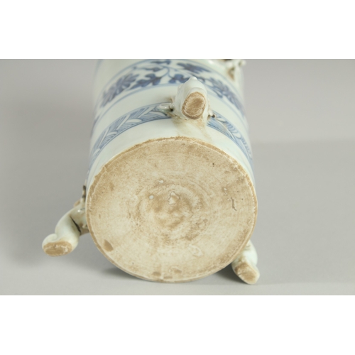 110 - A CHINESE BLUE AND WHITE PORCELAIN BRUSH POT / VASE, with moulded chilong and tripod legs, 15cm high... 