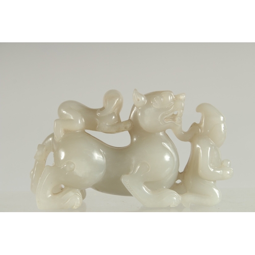 117 - A CHINESE CARVED JADE KYLIN PAPERWEIGHT, 12cm long.