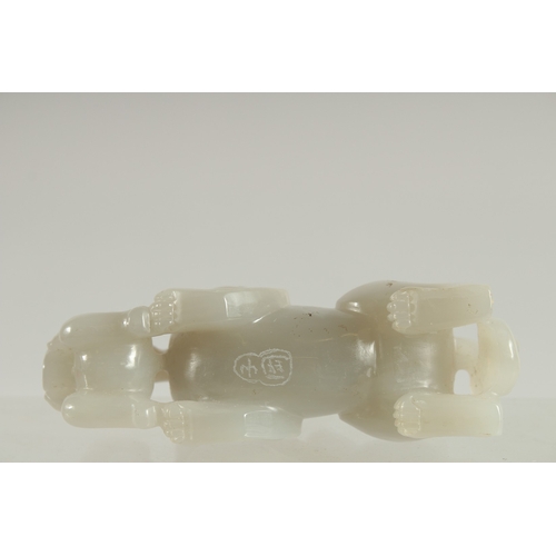 117 - A CHINESE CARVED JADE KYLIN PAPERWEIGHT, 12cm long.