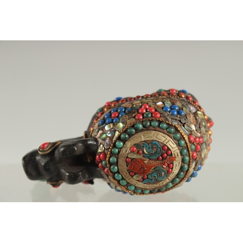 119 - A TIBETAN ABALONE INLAID FIGURE OF A TORTOISE, inset with various other beads, 9cm long.