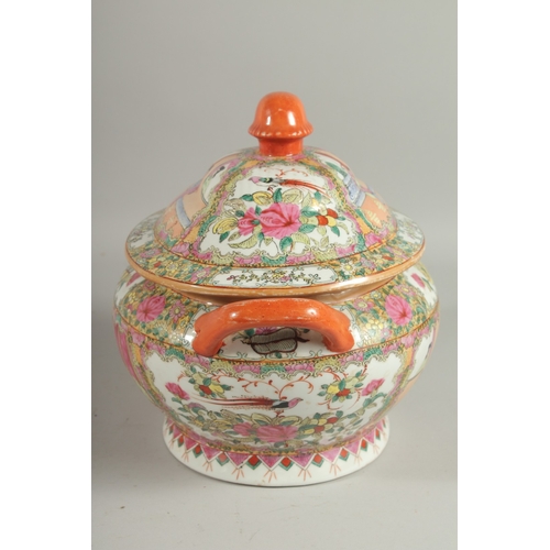 12 - A CHINESE CANTON FAMILLE ROSE PORCELAIN TUREEN AND COVER, painted with panels of scenes with figures... 