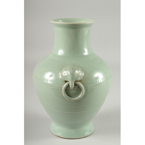 124 - A CHINESE CELADON GLAZED VASE, with moulded drop ring handles, the base with character mark, 25.5cm ... 