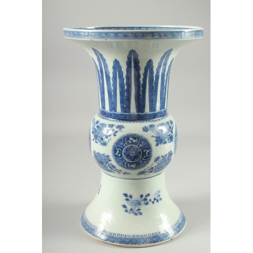 127 - A LARGE CHINESE BLUE AND WHITE PORCELAIN GU SHAPE VASE, decorated with floral motifs, (repair to rim... 