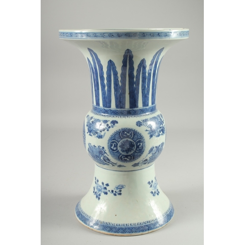 127 - A LARGE CHINESE BLUE AND WHITE PORCELAIN GU SHAPE VASE, decorated with floral motifs, (repair to rim... 