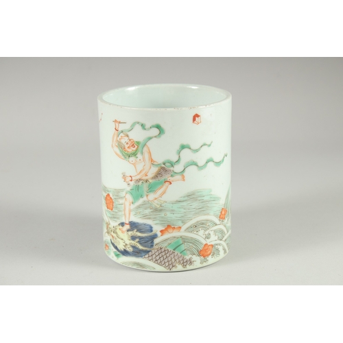 129 - A CHINESE FAMILLE VERTE PORCELAIN BRUSH POT, painted with an immortal stood upon a dragon on waves, ... 