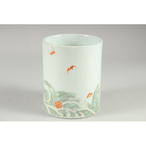 129 - A CHINESE FAMILLE VERTE PORCELAIN BRUSH POT, painted with an immortal stood upon a dragon on waves, ... 