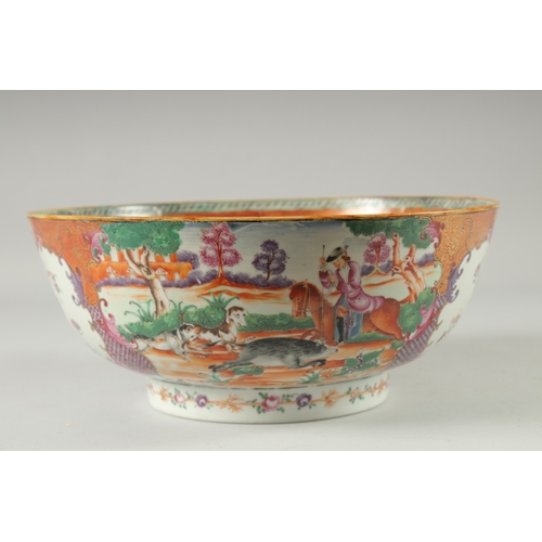 135 - A CHINESE EXPORT FAMILLE ROSE MANDARIN PATTERN PORCELAIN PUNCH BOWL, the exterior painted with two p... 