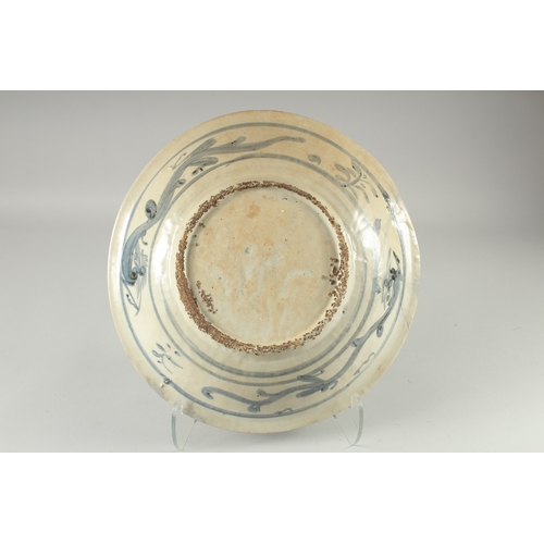 137 - A LARGE CHINESE WANLI BLUE AND WHITE DISH, painted with flora, (repair), 39.5cm diameter.