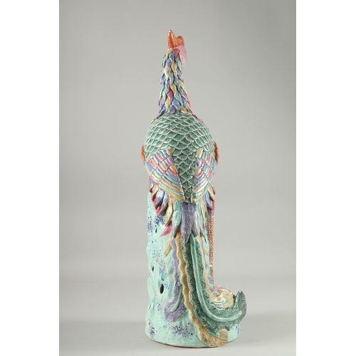 138 - A LARGE CHINESE FAMILLE ROSE PORCELAIN PHOENIX / FENGHUANG, painted with colourful feathers and stoo... 