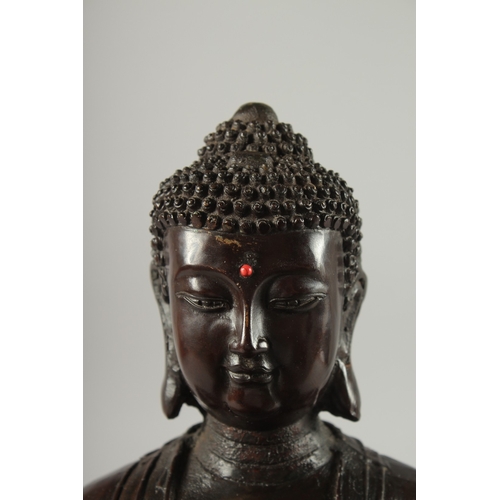 147 - A FINE LARGE BRONZE SEATED BUDDHA, the figure seated upon a double lotus base with character inscrip... 