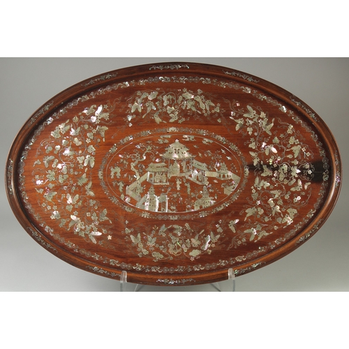 153 - A VERY FINE CHINESE MOTHER OF PEARL INLAID HARDWOOD OVAL TRAY, beautifully decorated with central pa... 