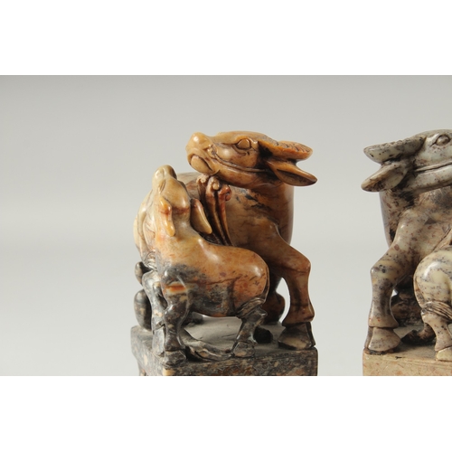 155 - A LARGE PAIR OF CHINESE CARVED BUFFALO SOAPSTONE SEALS, 20cm high.