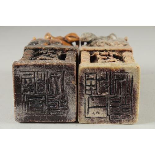 155 - A LARGE PAIR OF CHINESE CARVED BUFFALO SOAPSTONE SEALS, 20cm high.