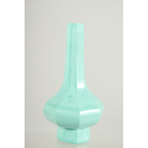 176 - A FINE TURQUOISE PEKING GLASS OCTAGONAL VASE, 19cm high.