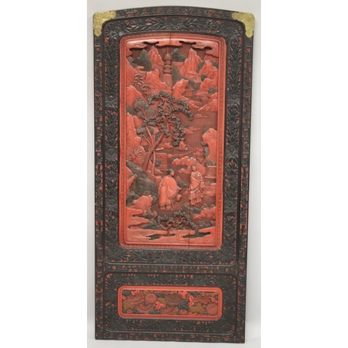 185 - A LARGE 19TH CENTURY CHINESE CARVED BLACK AND RED CINNABAR LACQUER PANEL, depicting two male figures... 