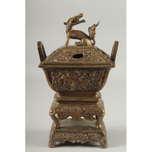 19 - A CHINESE BRASS CENSER, with beast-form finial, 30cm high.