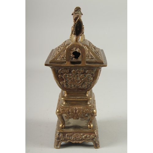 19 - A CHINESE BRASS CENSER, with beast-form finial, 30cm high.