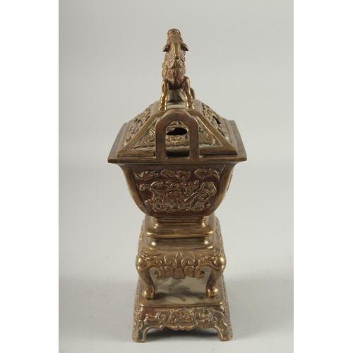 19 - A CHINESE BRASS CENSER, with beast-form finial, 30cm high.