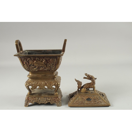 19 - A CHINESE BRASS CENSER, with beast-form finial, 30cm high.