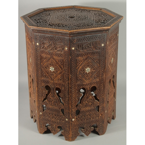 190 - A SYRIAN OCTAGONAL WOODEN TABLE, with mother of pearl inlay to the sides and carved panels of callig... 