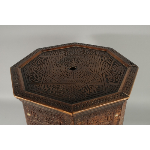 190 - A SYRIAN OCTAGONAL WOODEN TABLE, with mother of pearl inlay to the sides and carved panels of callig... 