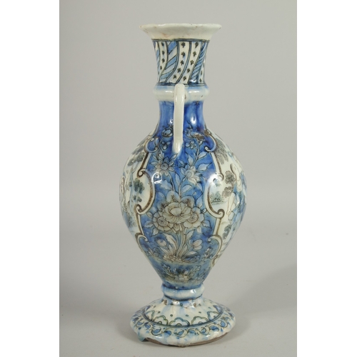 192 - A 19TH CENTURY PERSIAN QAJAR GLAZED POTTERY VASE, with twin handles and painted with a panelto each ... 