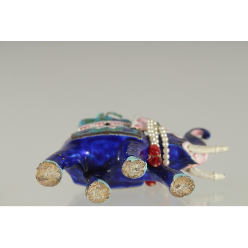 197 - AN EARLY 20TH CENTURY INDIAN BENARES ENAMELLED SILVER ELEPHANT, 10cm long.