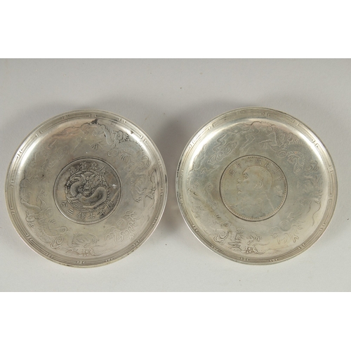 20 - TWO CHINESE COIN DISHES, 9cm diameter.