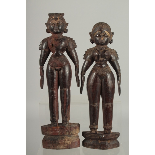 202 - TWO 19TH CENTURY SOUTH INDIAN -POSSIBLY TAMIL NADU CARVED WOOD FIGURES, 32cm and 30cm high.