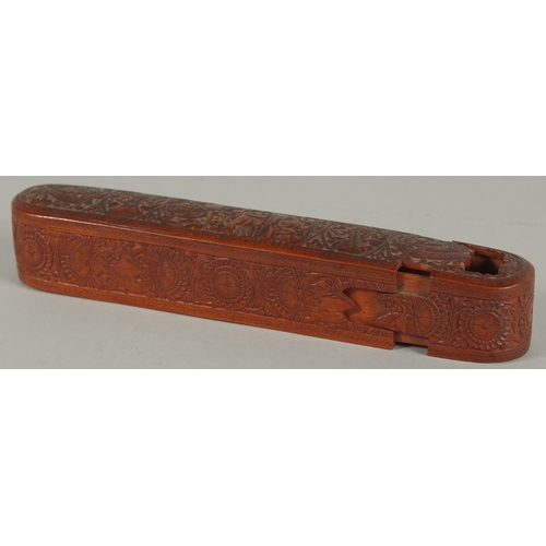 204 - A FINE 19TH CENTURY PERSIAN QAJAR ABADEH CARVED WOODEN QALAMDAN PEN BOX, 21cm long.