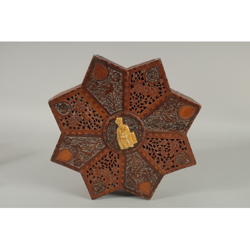 205 - A FINE 19TH CENTURY PERSIAN QAJAR ABADEH CARVED WOOD STAR-SHAPE BOX, the lid with carved and pierced... 