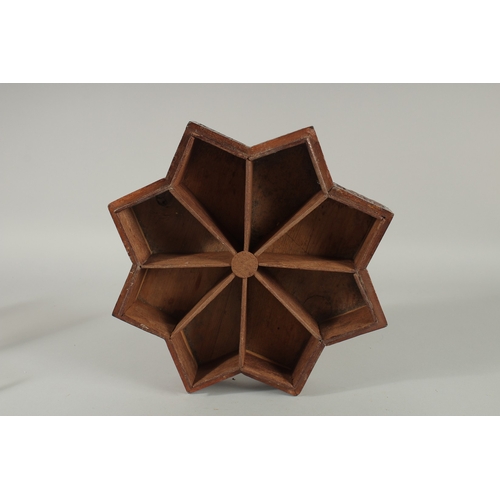 205 - A FINE 19TH CENTURY PERSIAN QAJAR ABADEH CARVED WOOD STAR-SHAPE BOX, the lid with carved and pierced... 