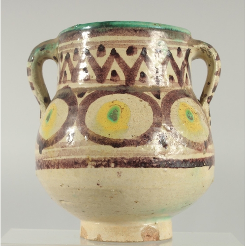 207 - AN 18TH CENTURY MOROCCAN OR TUNISIAN (QALLALIN) POTTERY TWIN HANDLED VASE, 18cm high.