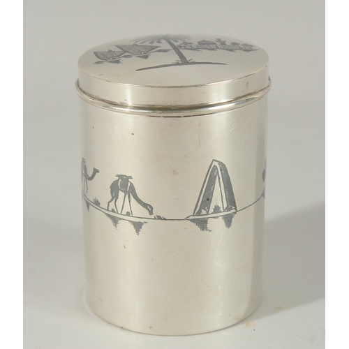 208 - A FINE IRAQI NIELLO INLAID SILVER CYLINDRICAL BOX; possibly a tea caddy, 9cm high.