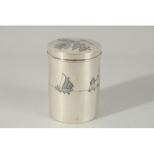 208 - A FINE IRAQI NIELLO INLAID SILVER CYLINDRICAL BOX; possibly a tea caddy, 9cm high.