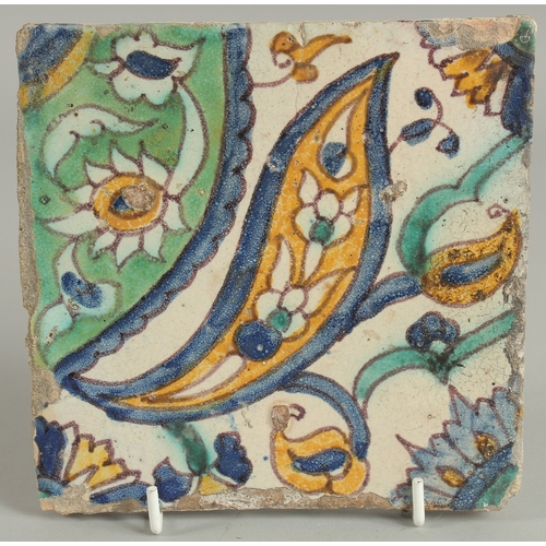 212 - AN 18TH CENTURY NORTH AFRICAN TUNISIAN TILE, 15cm square.