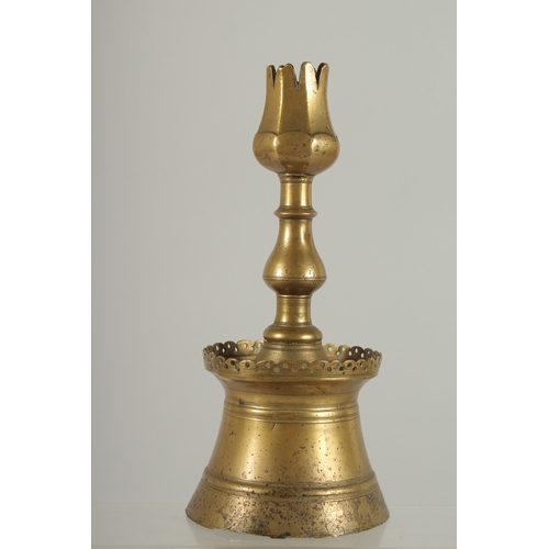 214 - A RARE 16TH-17TH CENTURY OTTOMAN TURKISH BRASS TULIP CANDLESTICK, 23cm high.