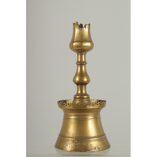 214 - A RARE 16TH-17TH CENTURY OTTOMAN TURKISH BRASS TULIP CANDLESTICK, 23cm high.