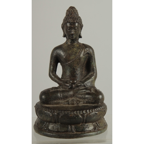 217 - AN EARLY SOUTH EAST ASIAN BRONZE BUDDHA, 12.5cm high.