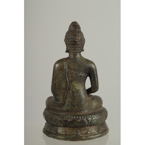 217 - AN EARLY SOUTH EAST ASIAN BRONZE BUDDHA, 12.5cm high.