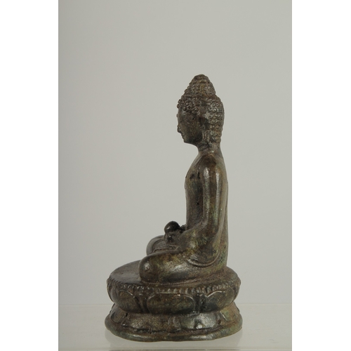 217 - AN EARLY SOUTH EAST ASIAN BRONZE BUDDHA, 12.5cm high.