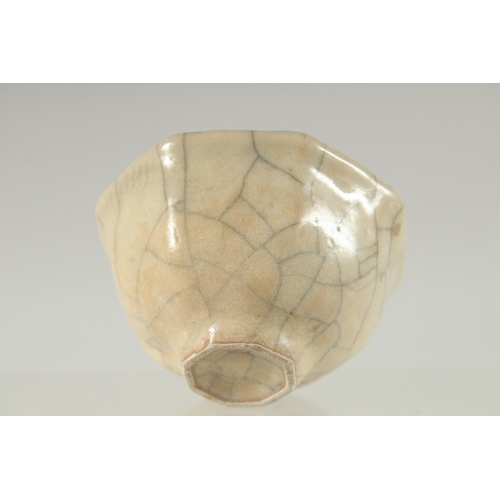 22 - A SMALL CHINESE OCTAGONAL CRACKLE GLAZE BOWL, 9cm wide.