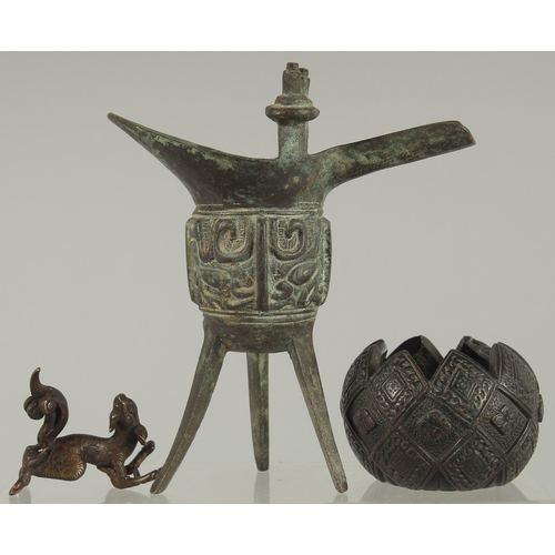 223 - A SMALL CHINESE MING BRONZE FIGURE, together with an archaic style jue cup and a Japanese bronze bow... 