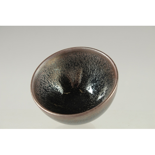 23 - A CHINESE GLAZED POTTERY TEA BOWL, character mark to base, 9cm diameter.