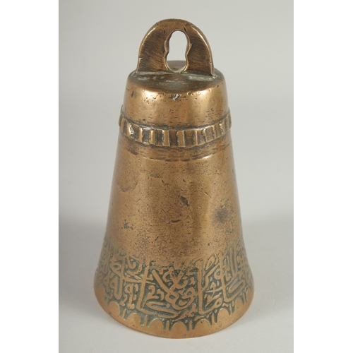 234 - AN 18TH CENTURY ISLAMIC BRASS BELL, with a band of calligraphic inscription, 17.5cm high.