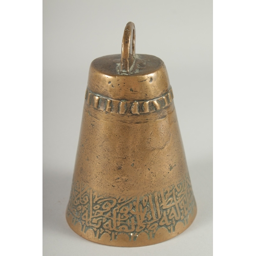 234 - AN 18TH CENTURY ISLAMIC BRASS BELL, with a band of calligraphic inscription, 17.5cm high.