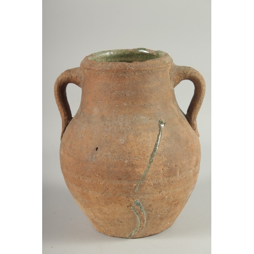 236 - A 10TH-12TH CENTURY IRANIAN TERRACOTTA TWIN HANDLE POT, with glazed green interior, 22.5cm high.