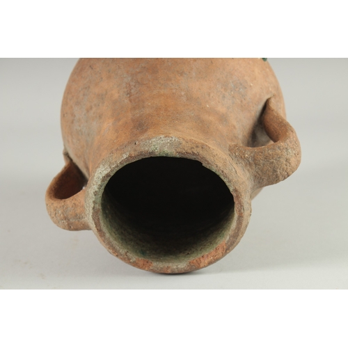 236 - A 10TH-12TH CENTURY IRANIAN TERRACOTTA TWIN HANDLE POT, with glazed green interior, 22.5cm high.