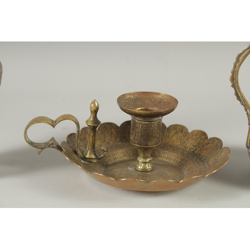 239 - THREE 19TH CENTURY IRANIAN ENGRAVED BRASS PIECES; comprising a twin handle vase / vessel with callig... 