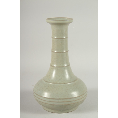 24 - A CHINESE CELADON GLAZE BOTTLE VASE, 22.5cm high.